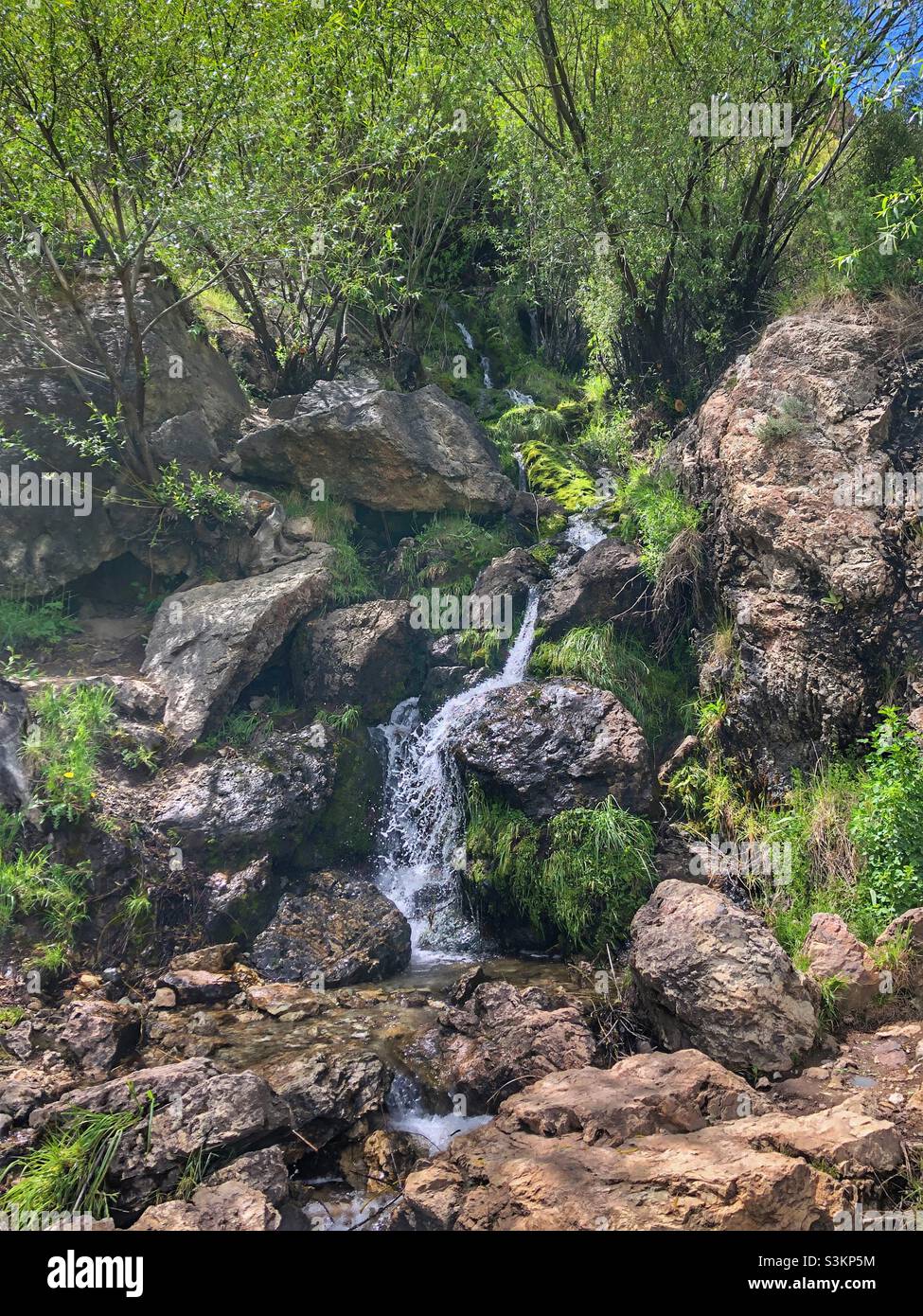 A small mountain waterfall. - Smartphone Captured Stock Image