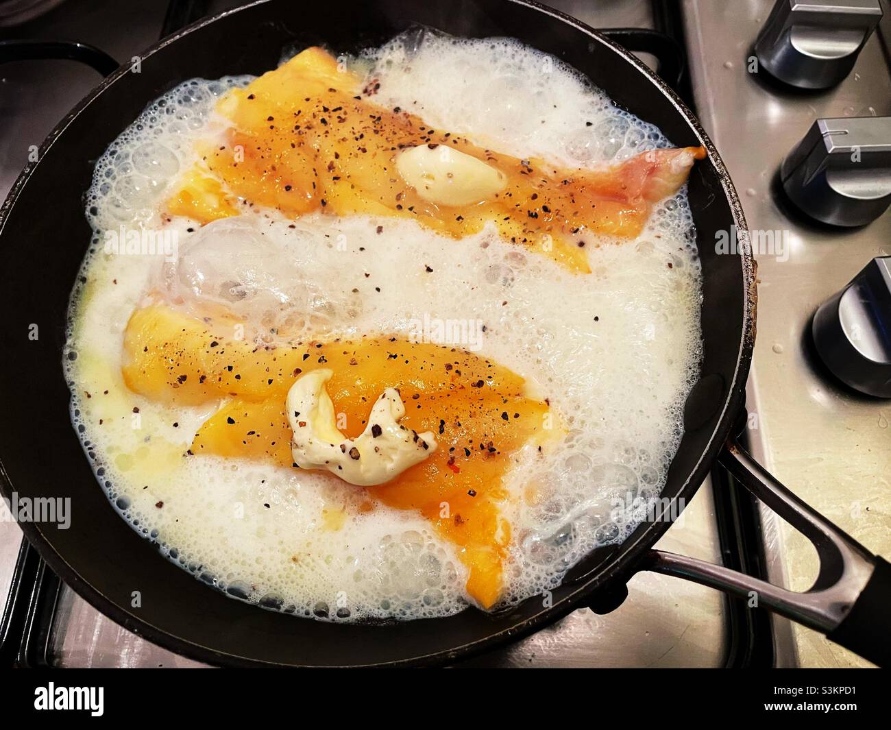 Haddock cooked in milk Stock Photo Alamy