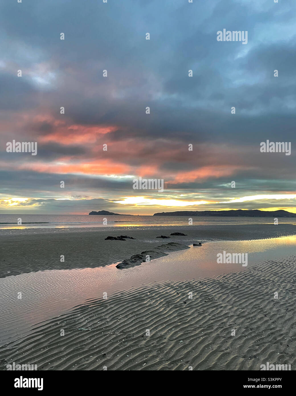 Sunrise on a cold Irish beach in November Stock Photo