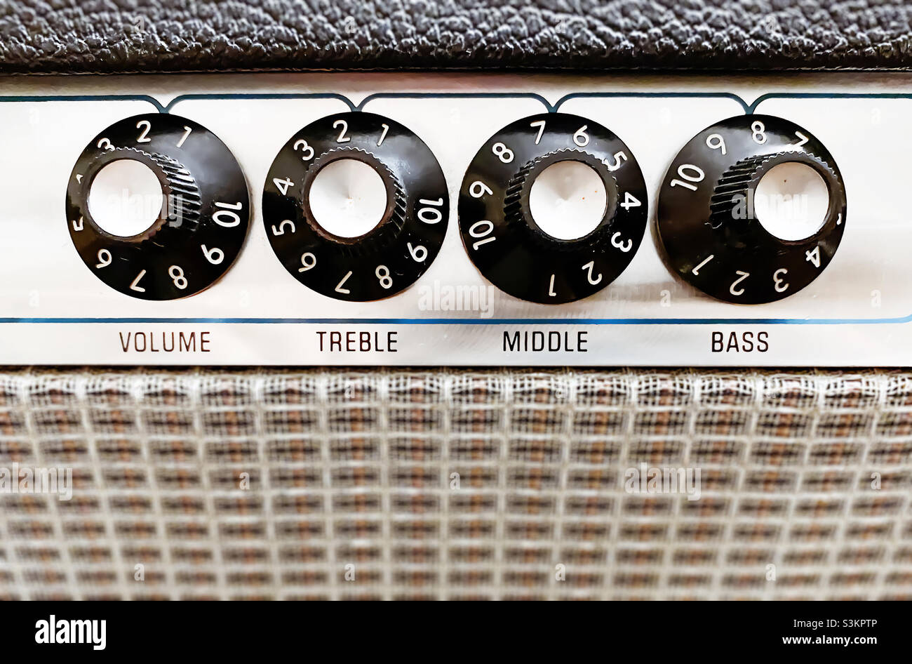 Close-up view of the knobs of an amplifier for adjusting the sound of stringed musical instruments. Concert and live performance. Music and entertainment - Smartphone Captured Stock Image