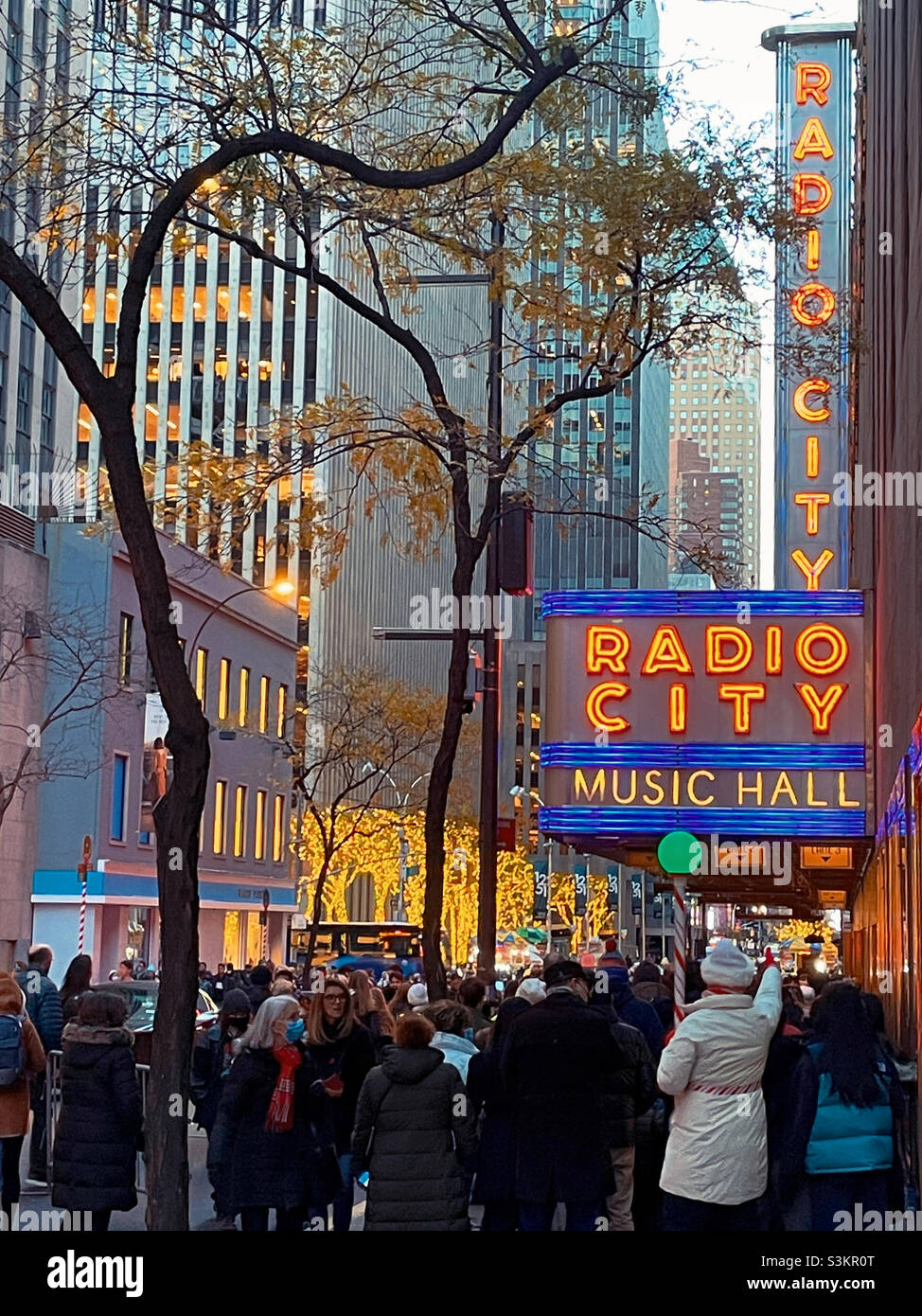 During the holiday season huge crowds lineup outside of radio city music Hall to see the Christmas spectacular featuring the Rockettes, 2021, New York City, United States - Smartphone Captured Stock Image