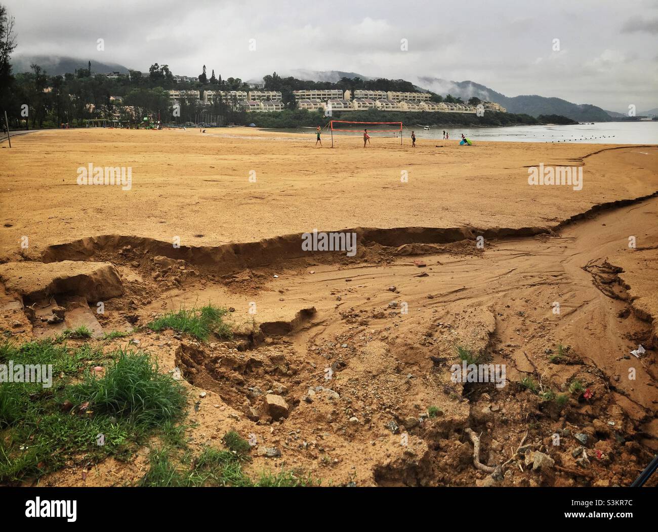 Erosion of the beach by runoff after heavy rain, Tai Pak Bay, Lantau Island, Hong Kong - Smartphone Captured Stock Image