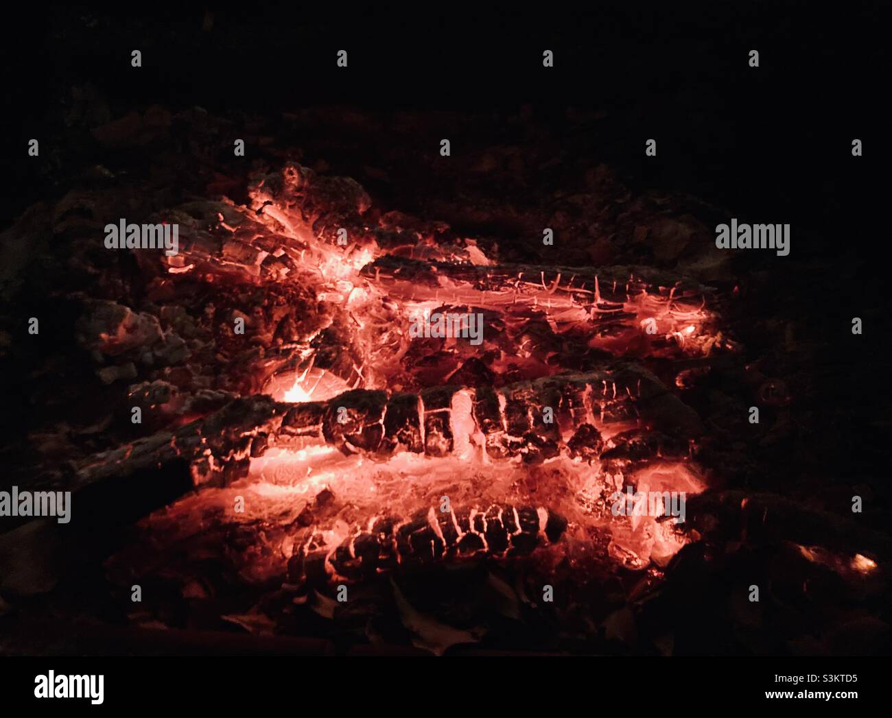 the red wood glow of a chimney fire - Smartphone Captured Stock Image