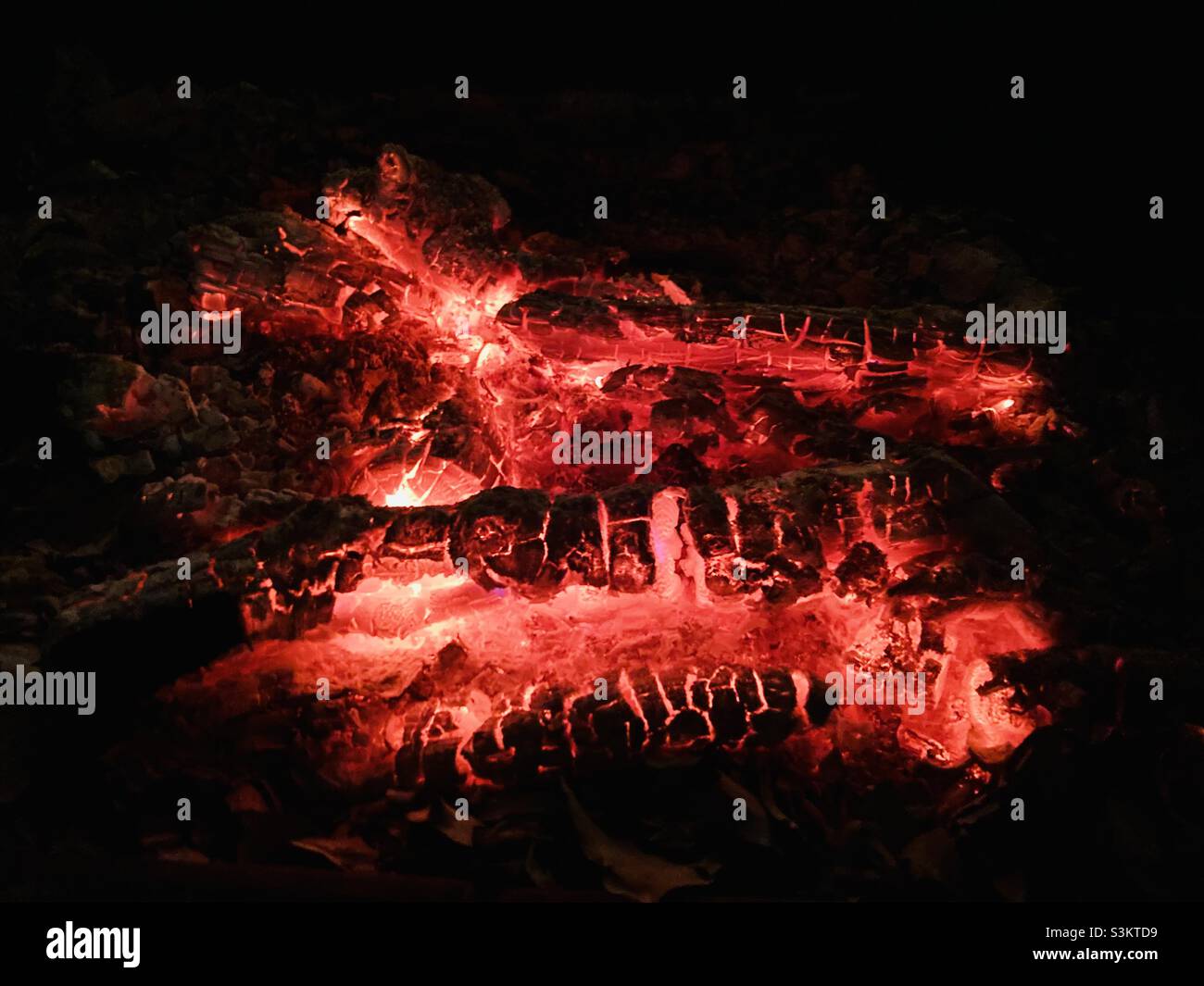 the red wood glow of a chimney fire - Smartphone Captured Stock Image