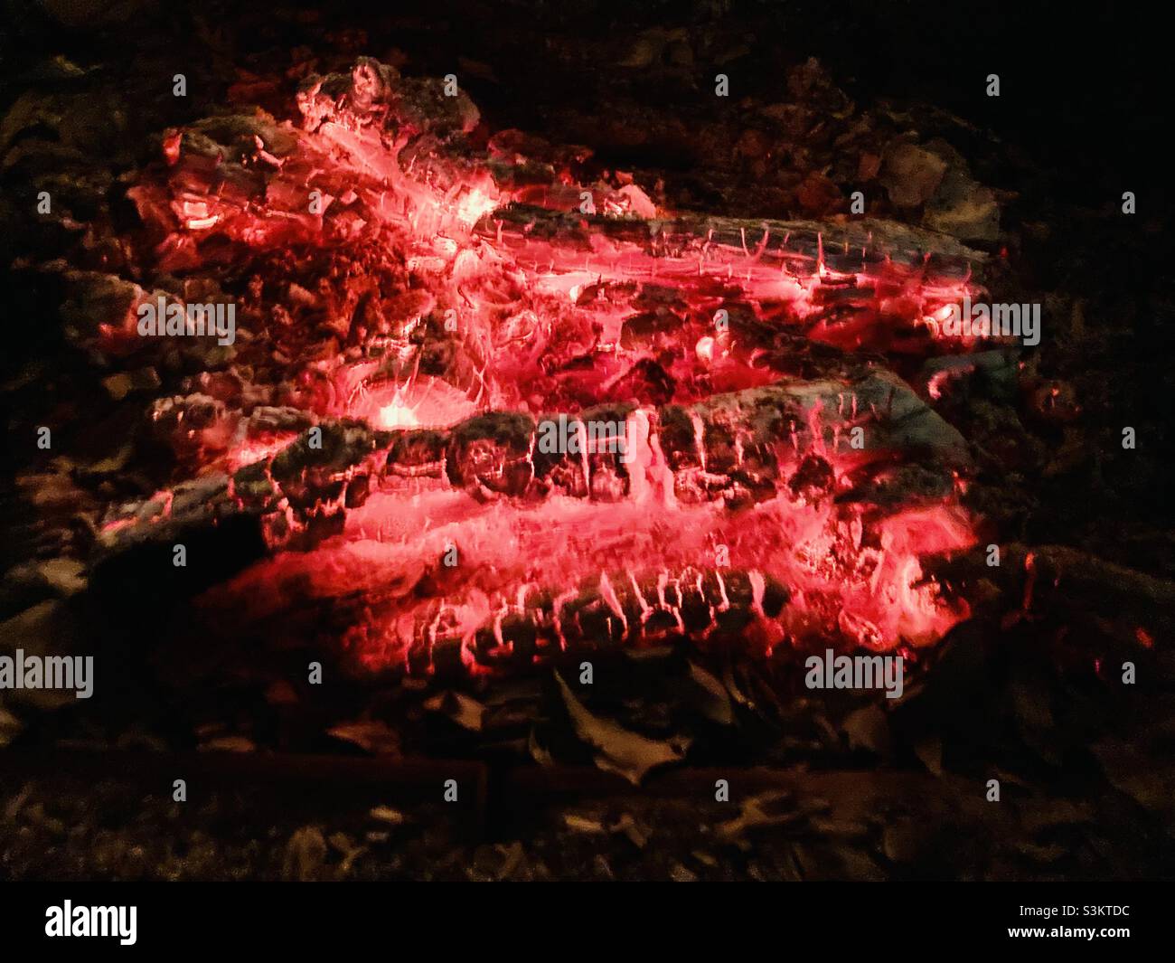 the red wood glow of a chimney fire - Smartphone Captured Stock Image