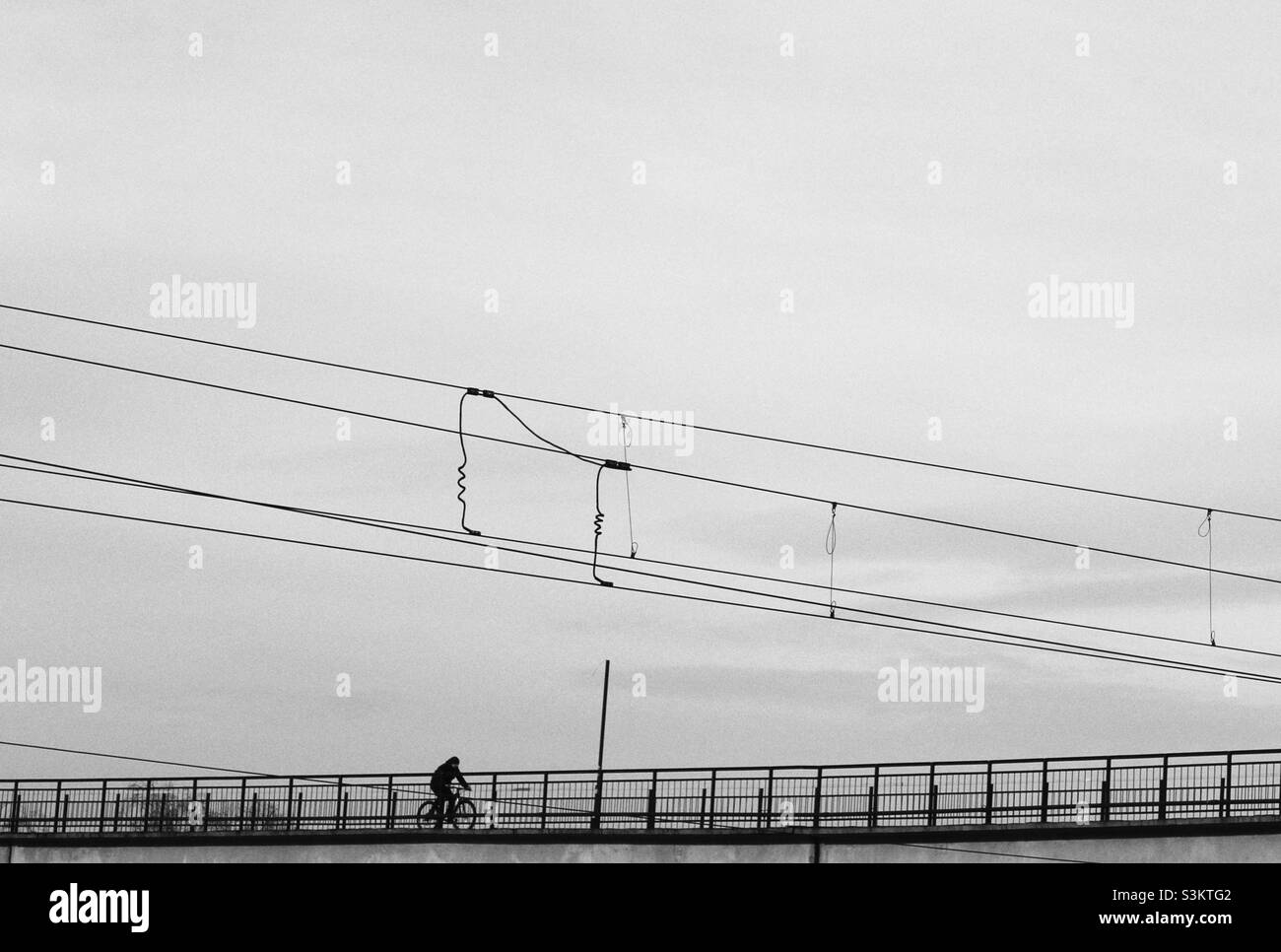 Crossing the bridge on the bicycle Stock Photo