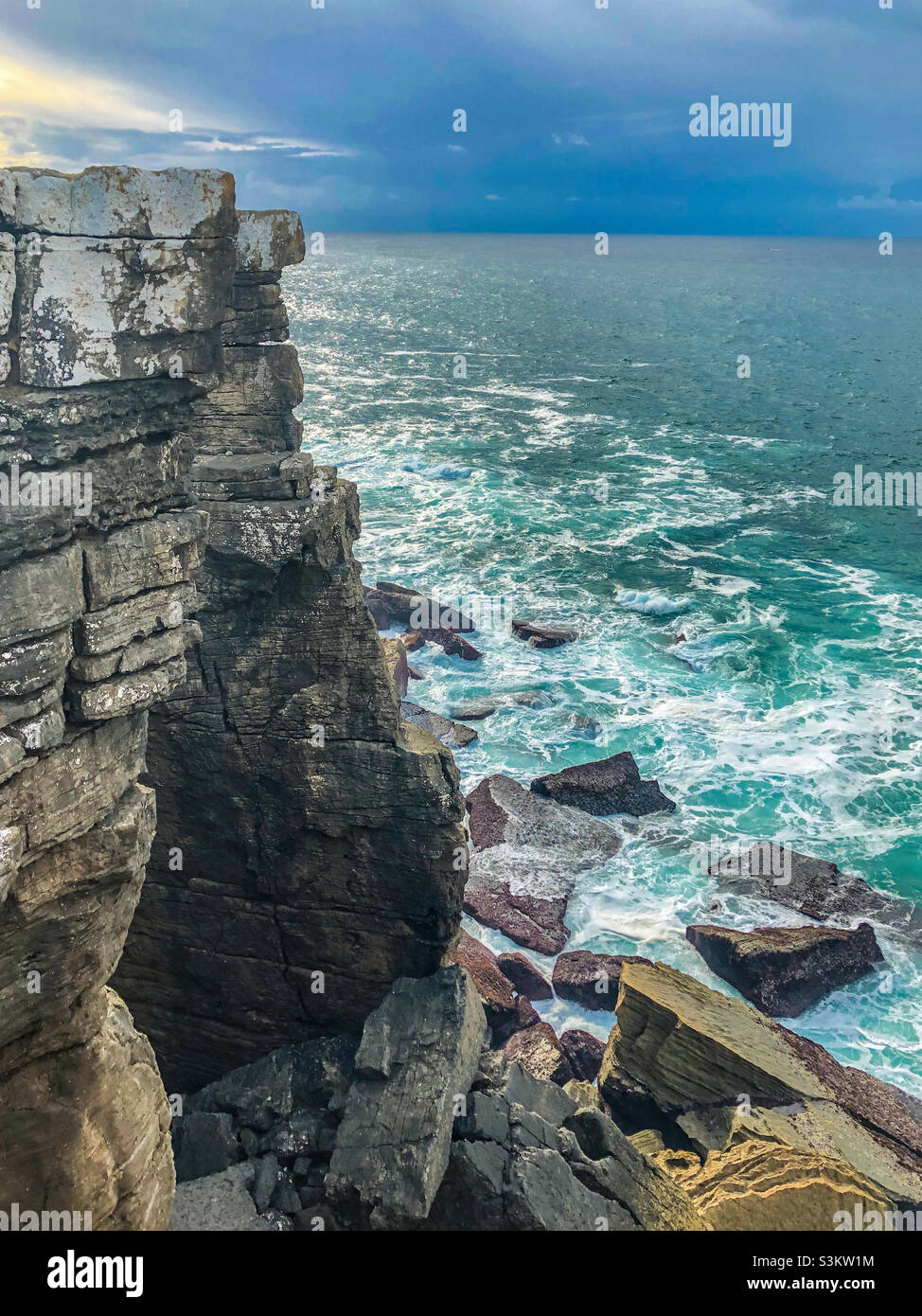 The dramatic rocky coastline is beaten by Atlantic waves, at Peniche ,Portugal - Smartphone Captured Stock Image