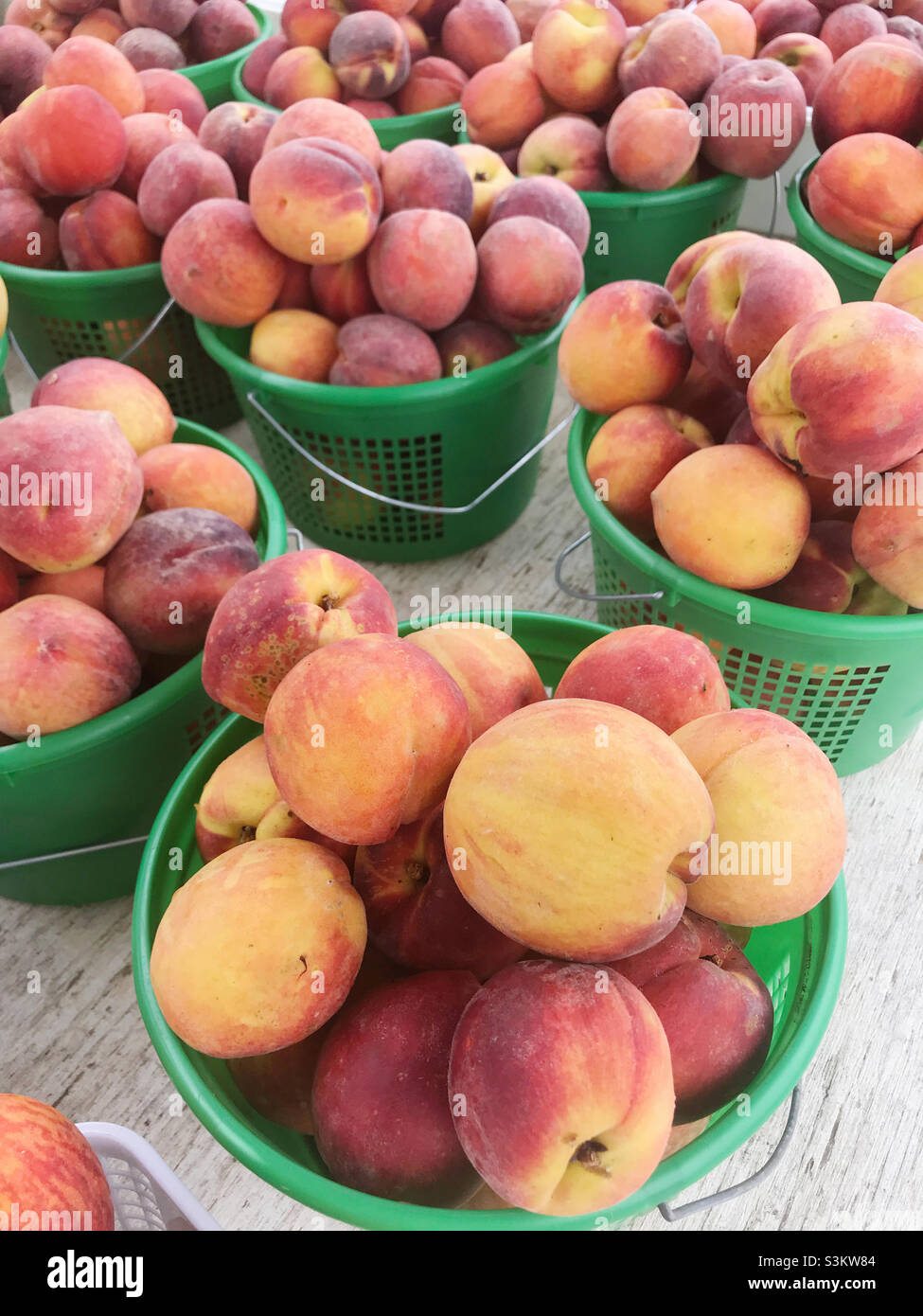 Fresh and just picked peaches for sale at a farmers market
