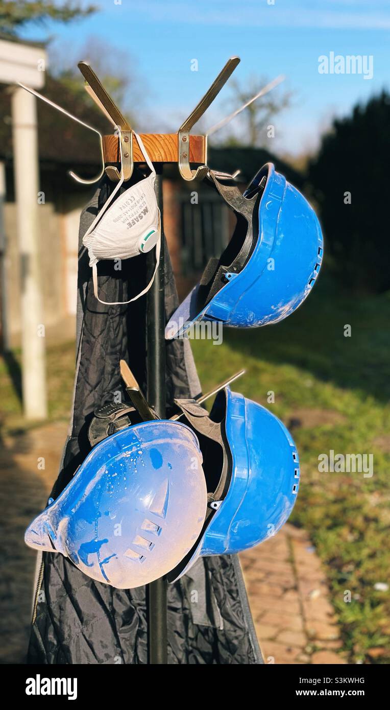 Safety helmets and a dust mask on a construction site - Smartphone Captured Stock Image