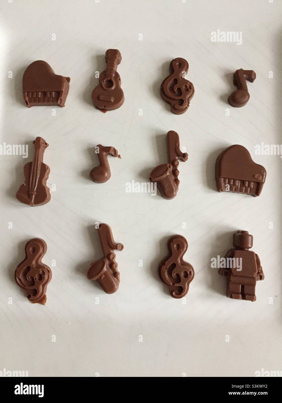 Musical chocolate shapes on a white plate Stock Photo