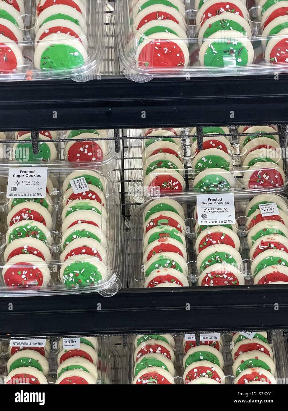 Frosted red and green Christmas cookies line the shelves at a local Walmart in Utah, USA. - Smartphone Captured Stock Image