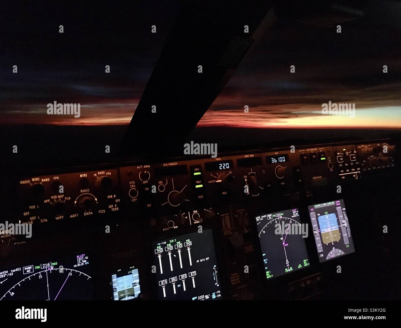 Sunset from flight deck of Boeing 747-800 Stock Photo