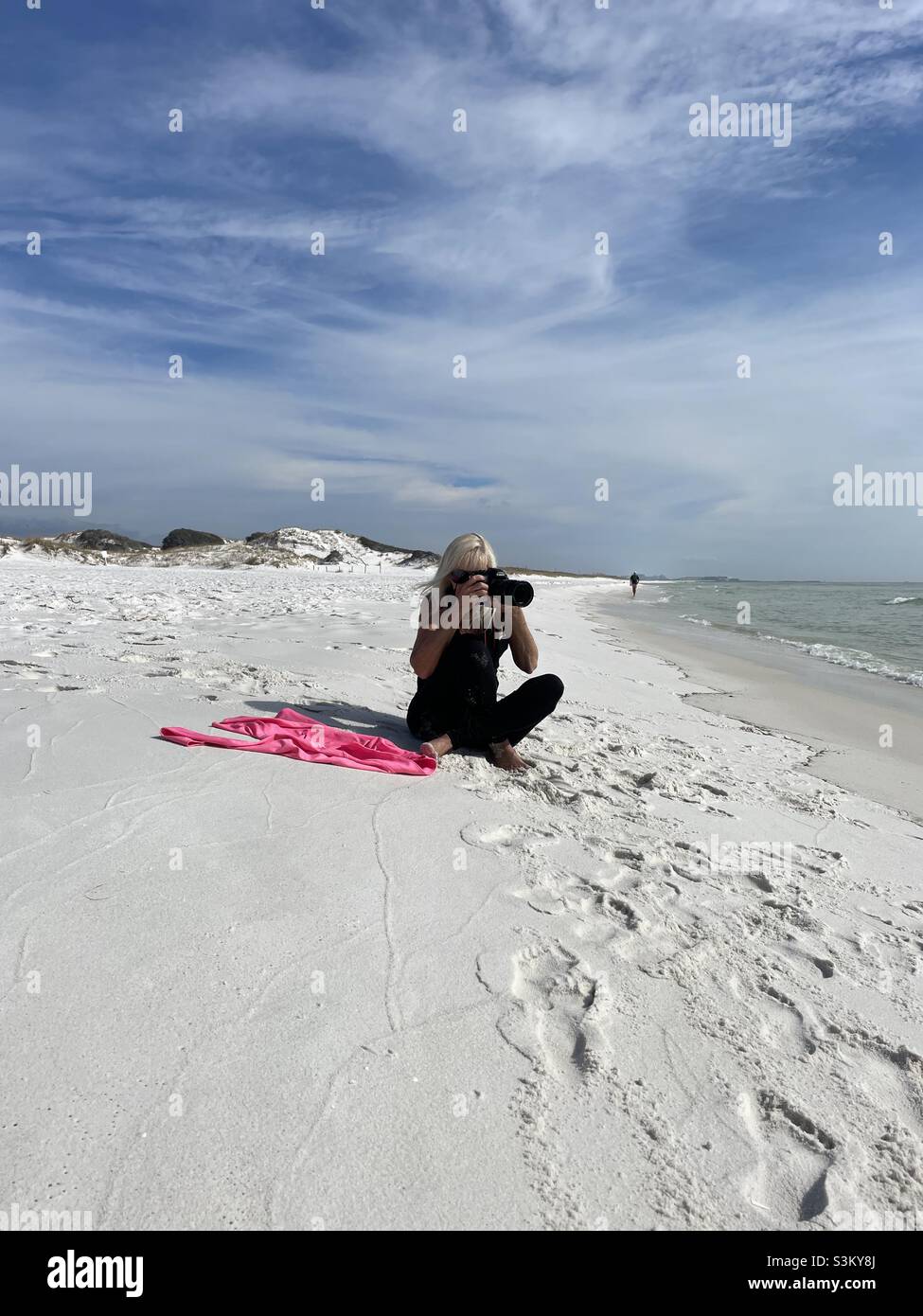 Clicking photos on ??????? white sand beach - Smartphone Captured Stock Image