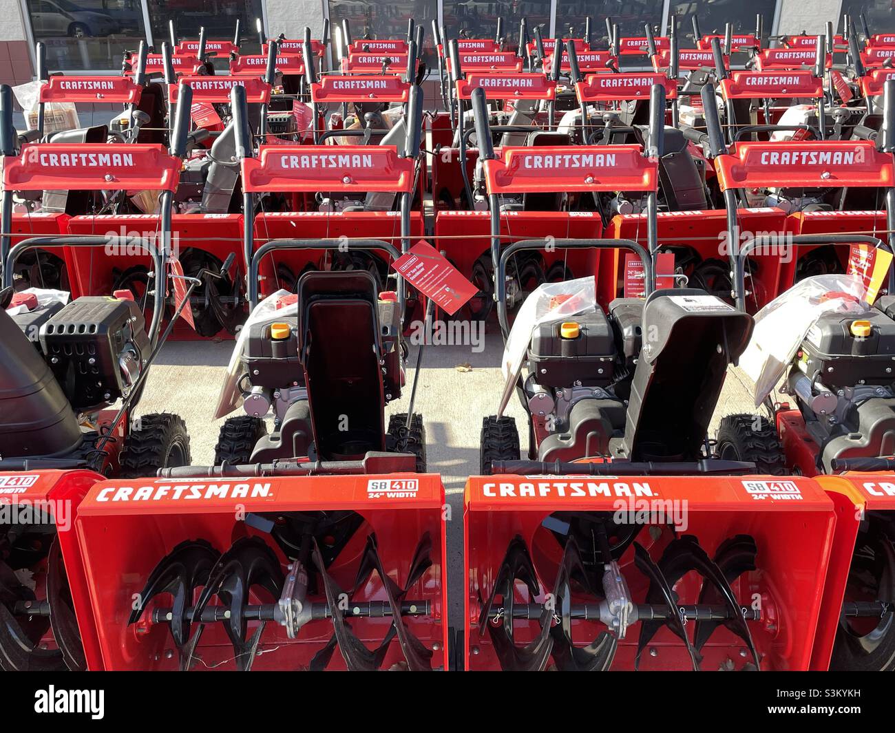 Lined up and ready for the winter, these Craftsman snow blowers were parked near the Garden Center at a local Lowe’s in Utah, USA. - Smartphone Captured Stock Image