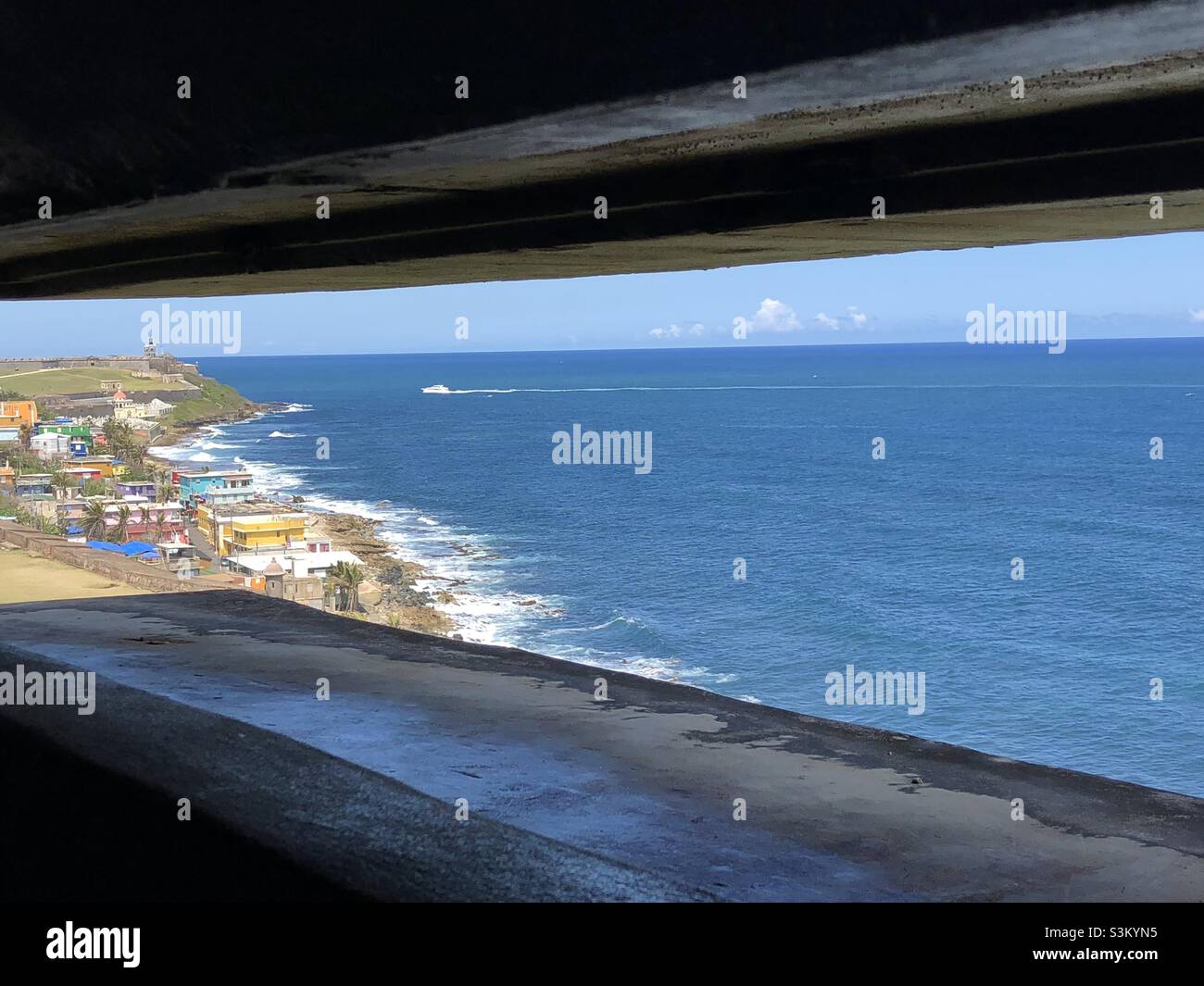 View over the ocean and La Perla from the San Juan National Historic Site Stock Photo