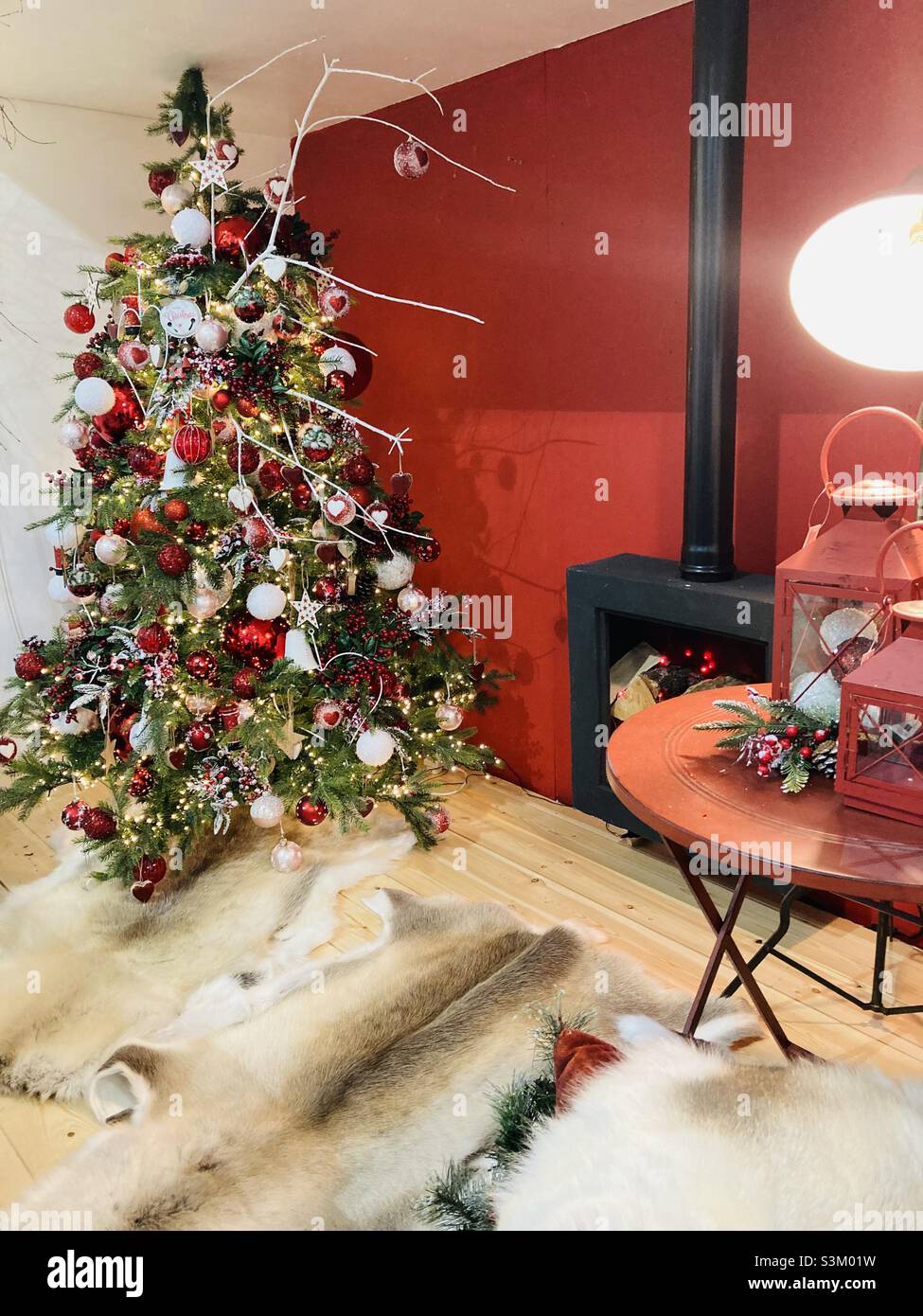 Christmas tree in a winter hut Stock Photo Alamy