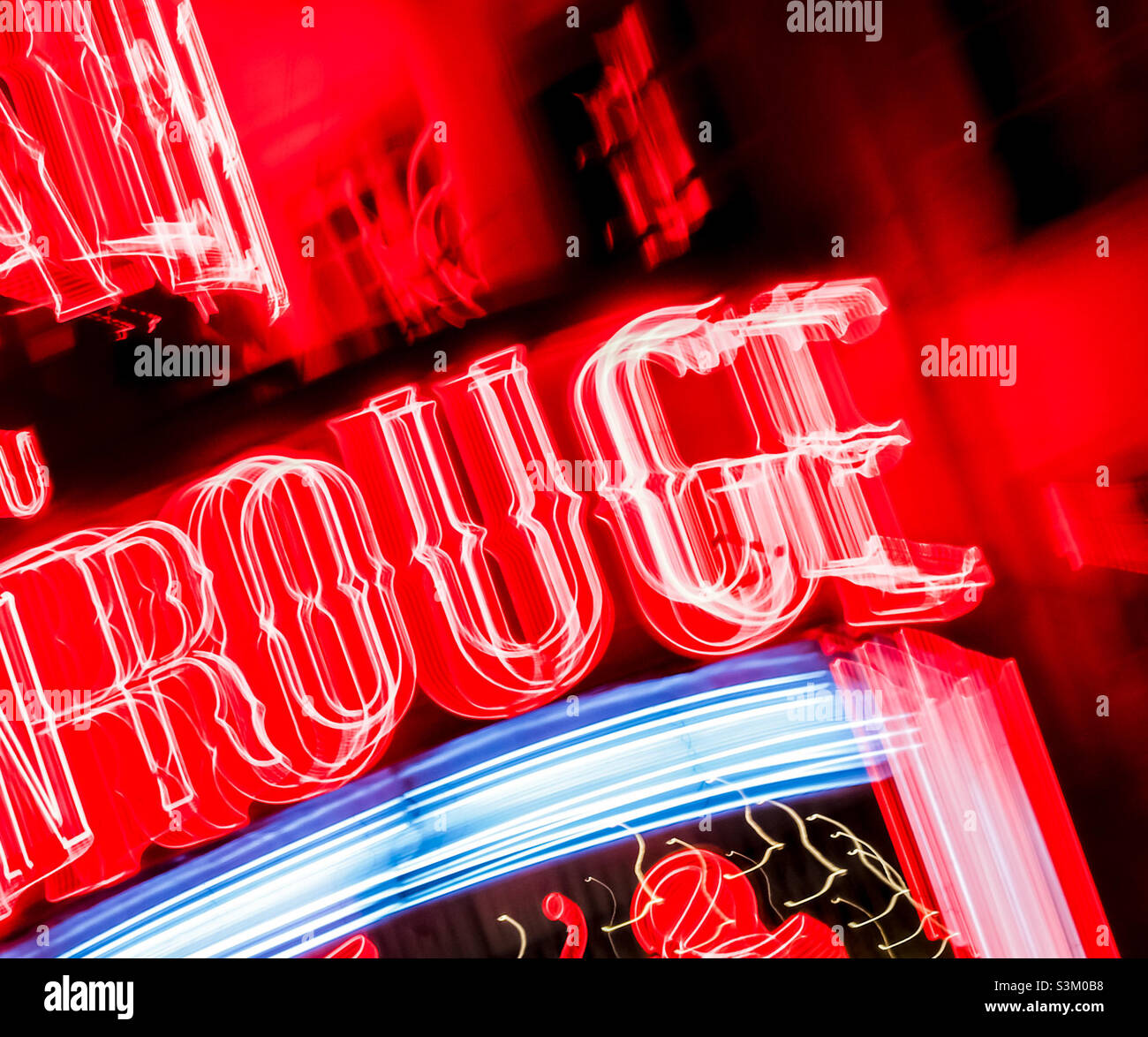 Zoom burst on part of the neon Moulin Rouge sign in Paris - Smartphone Captured Stock Image