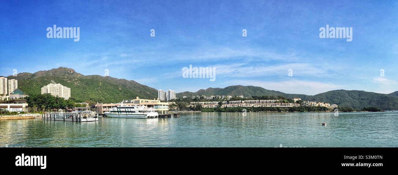 A ferry moored at the pier at Discovery Bay, Lantau Island, Hong Kong - Smartphone Captured Stock Image