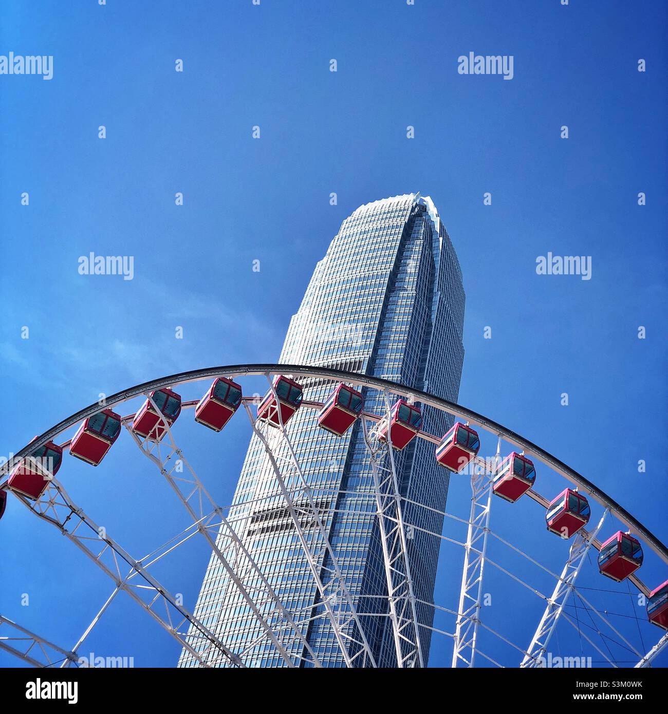 2ifc (2 International Finance Centre), a skyscraper in Central and Hong Kong's second tallest building, and the Hong Kong Observation Wheel - Smartphone Captured Stock Image