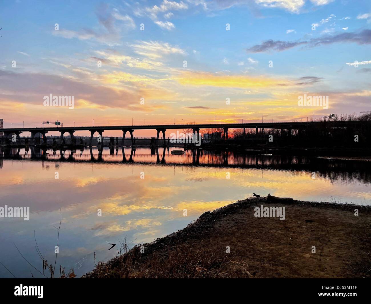 A bridge over the river at sunrise. Stock Photo