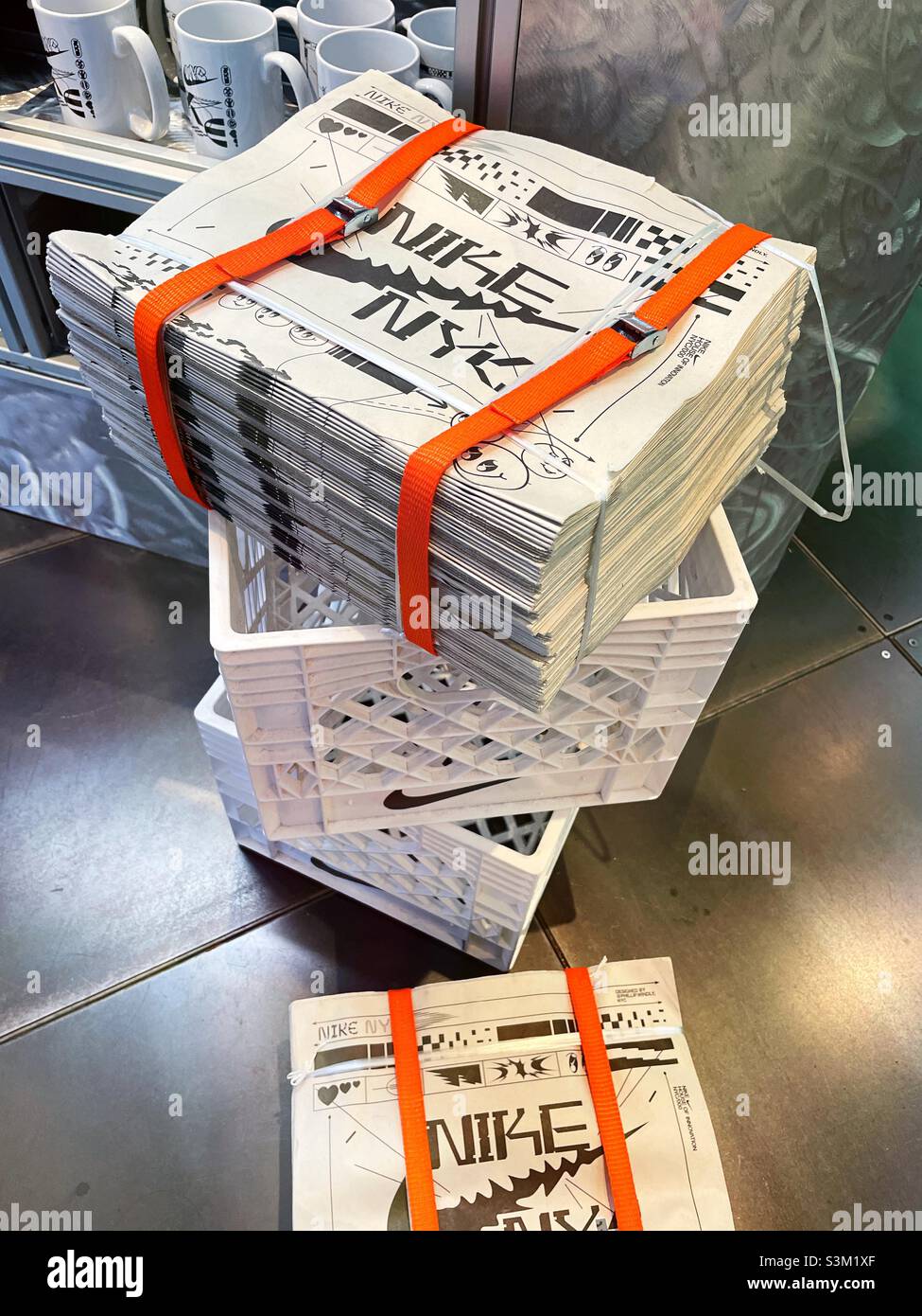 Bundles of newspaper fliers, Nike Store on fifth Avenue , 2021, New York  City, United States Stock Photo - Alamy