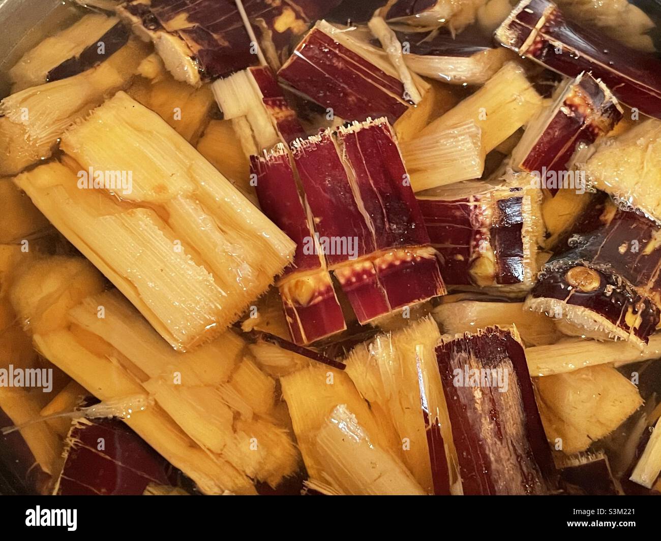 Simmering purple sugarcane in Malaysia. Stock Photo