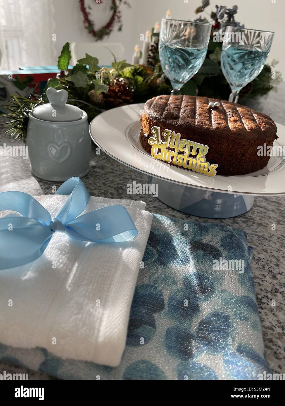 Fruit cake and  wine on Christmas table Stock Photo