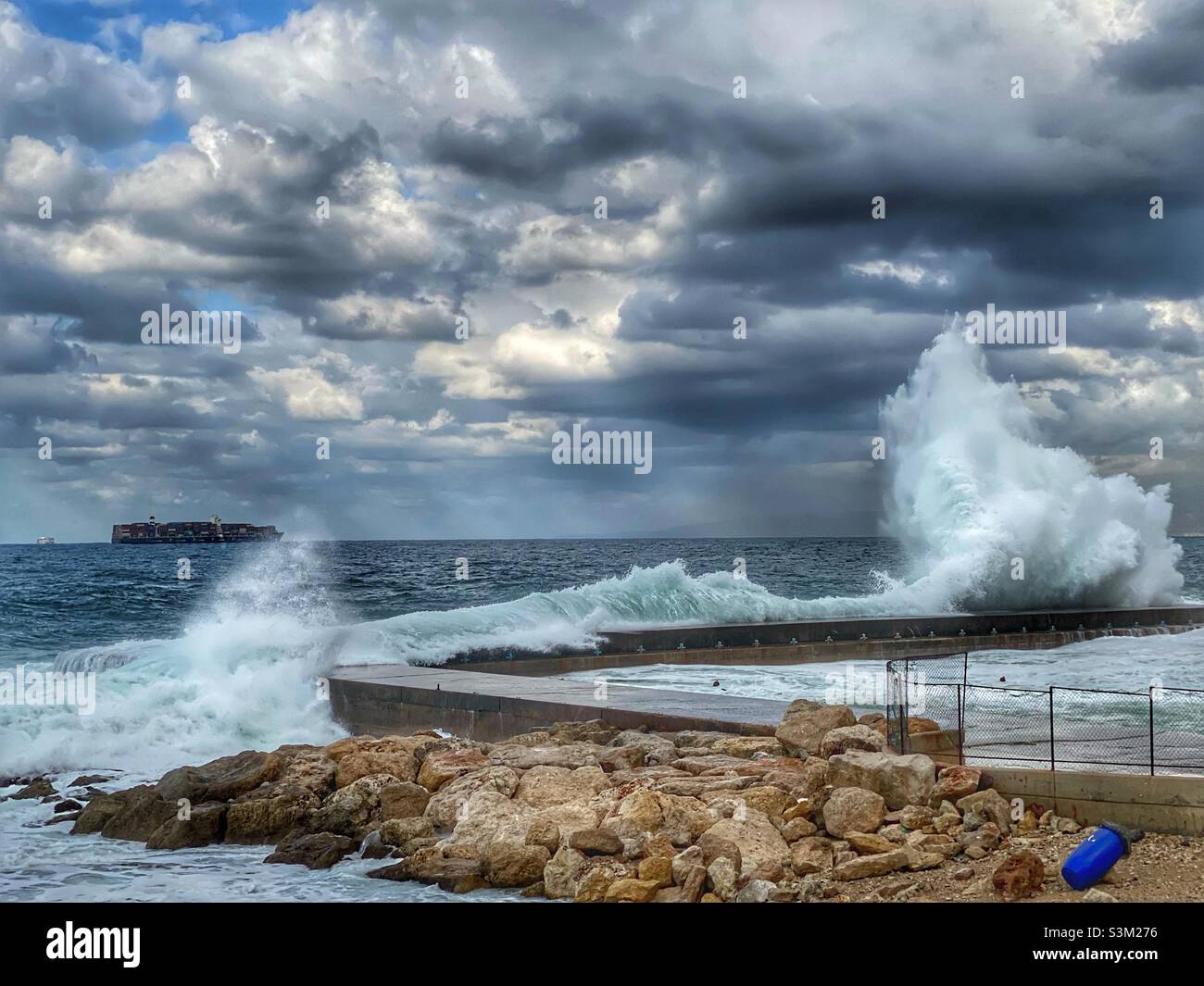 Sea waves hitting the fishing docks in Beirut Lebanon in winter season Stock Photo