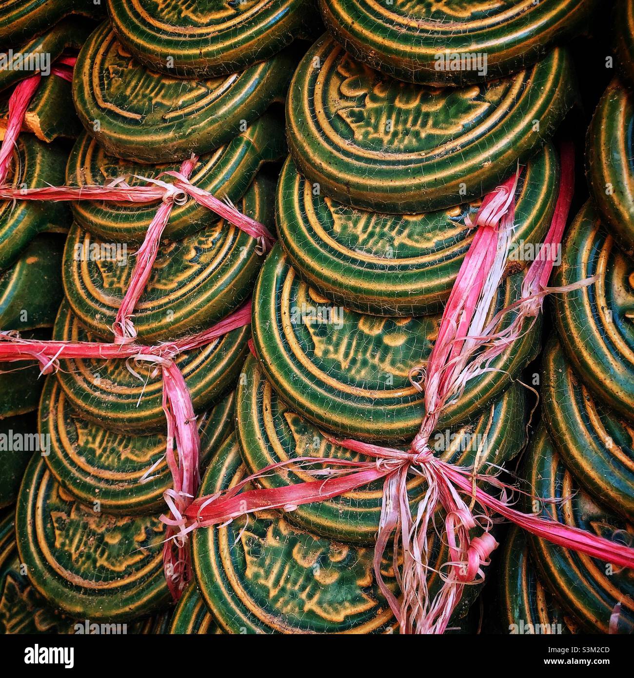 Chinese end-cap roof tiles awaiting installation, New Territories, Hong Kong - Smartphone Captured Stock Image