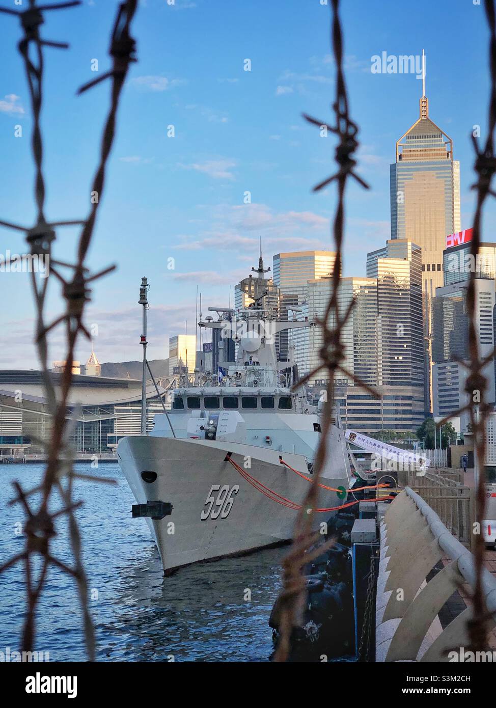 Jiangdao Class (Type 056) stealth corvette 'Huizhou' moored in Victoria Harbour, near the People's Liberation Army Garrison to which it is attached, Admiralty, Hong Kong Island, February 2021 - Smartphone Captured Stock Image