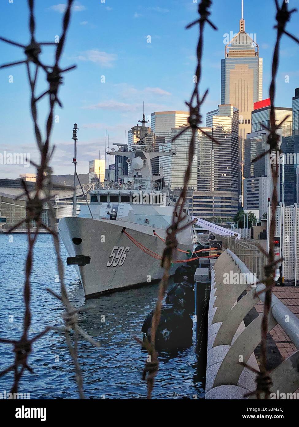 Jiangdao Class (Type 056) stealth corvette 'Huizhou' moored in Victoria Harbour, near the People's Liberation Army Garrison to which it is attached, Admiralty, Hong Kong Island, February 2021 - Smartphone Captured Stock Image