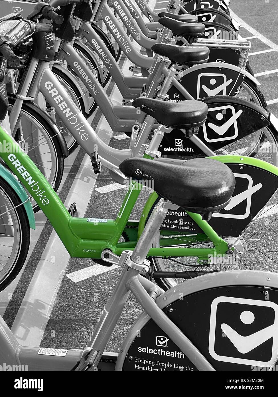 Greenbike, bicycles for rent for transportation that is both healthy and eco-friendly. These bikes are sponsored by health provider Selecthealth and are available around Salt Lake City, Utah, USA. - Smartphone Captured Stock Image
