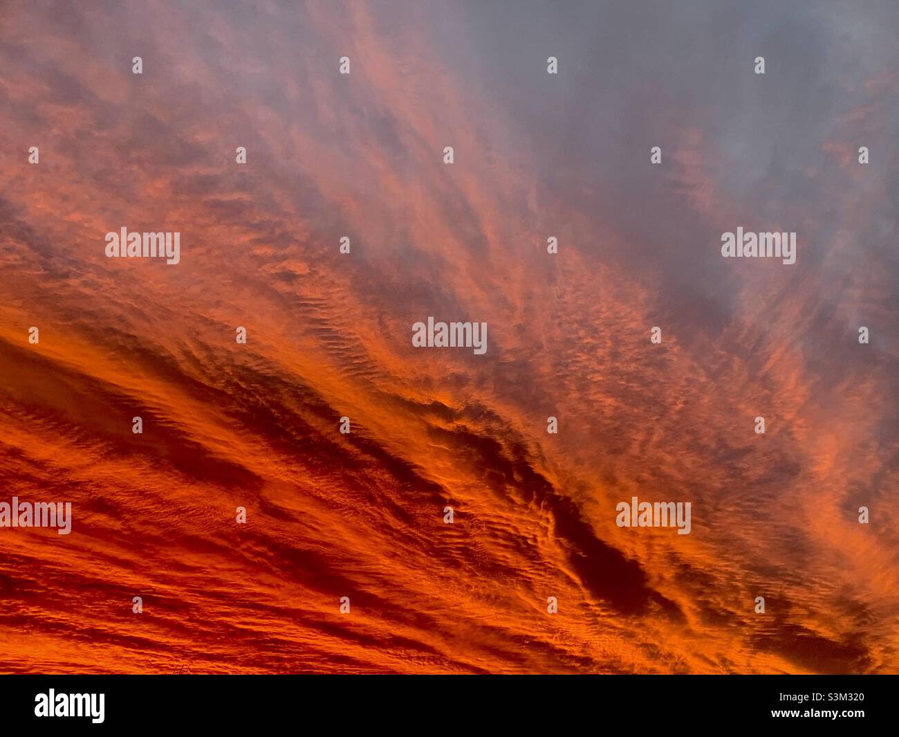 Orange fiery dramatic sky at sunrise Stock Photo