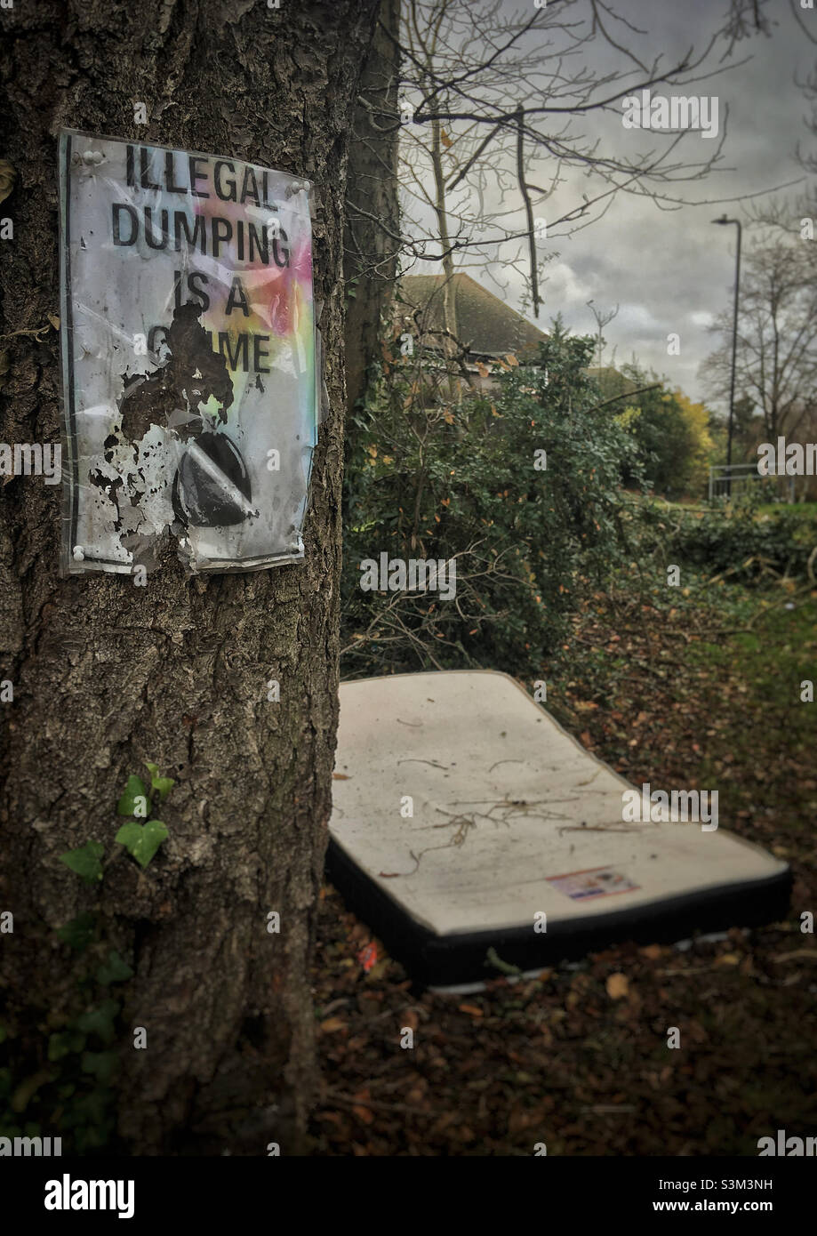 Illegal dumping is a crime - Smartphone Captured Stock Image