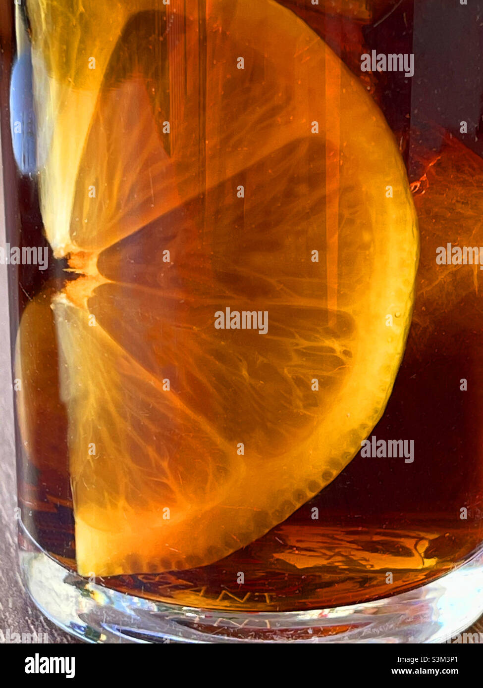 Lemon slice in vermouth glass. - Smartphone Captured Stock Image