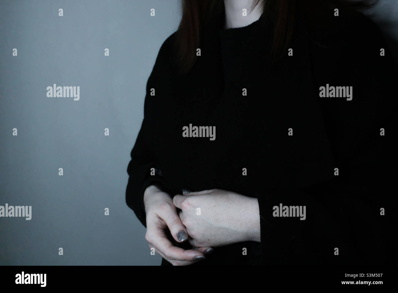 Woman in a black coat - Smartphone Captured Stock Image