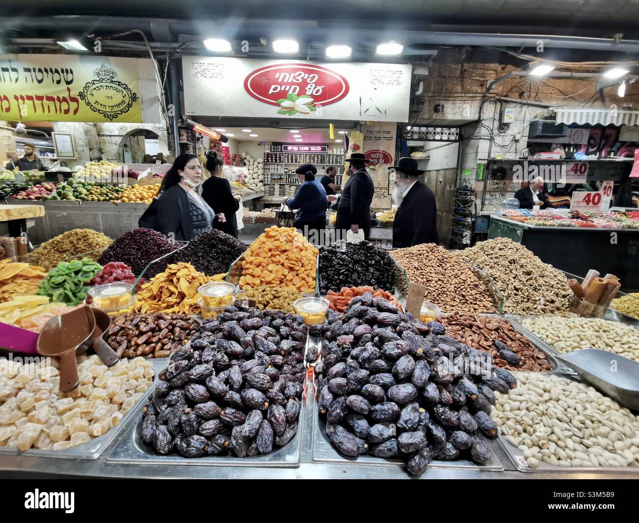 Dried fruits and spice shop at the vibrant Machane Yehuda market in Jerusalem, Israel. - Smartphone Captured Stock Image