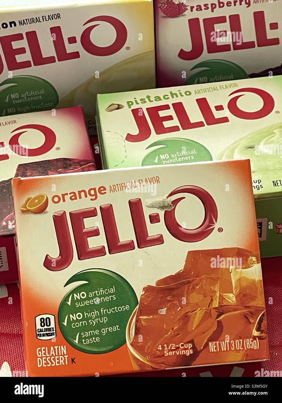A still life of boxes of jell-o mixes of multiple flavors: raspberry, orange and pistachio. - Smartphone Captured Stock Image