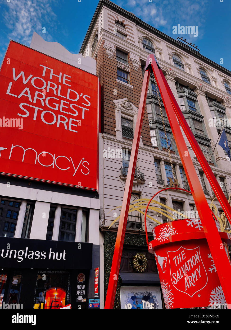 A giant salvation army donation Kettl display in Herald Square in front of Macy’s department store during the 2021 holiday season, New York City, United States - Smartphone Captured Stock Image