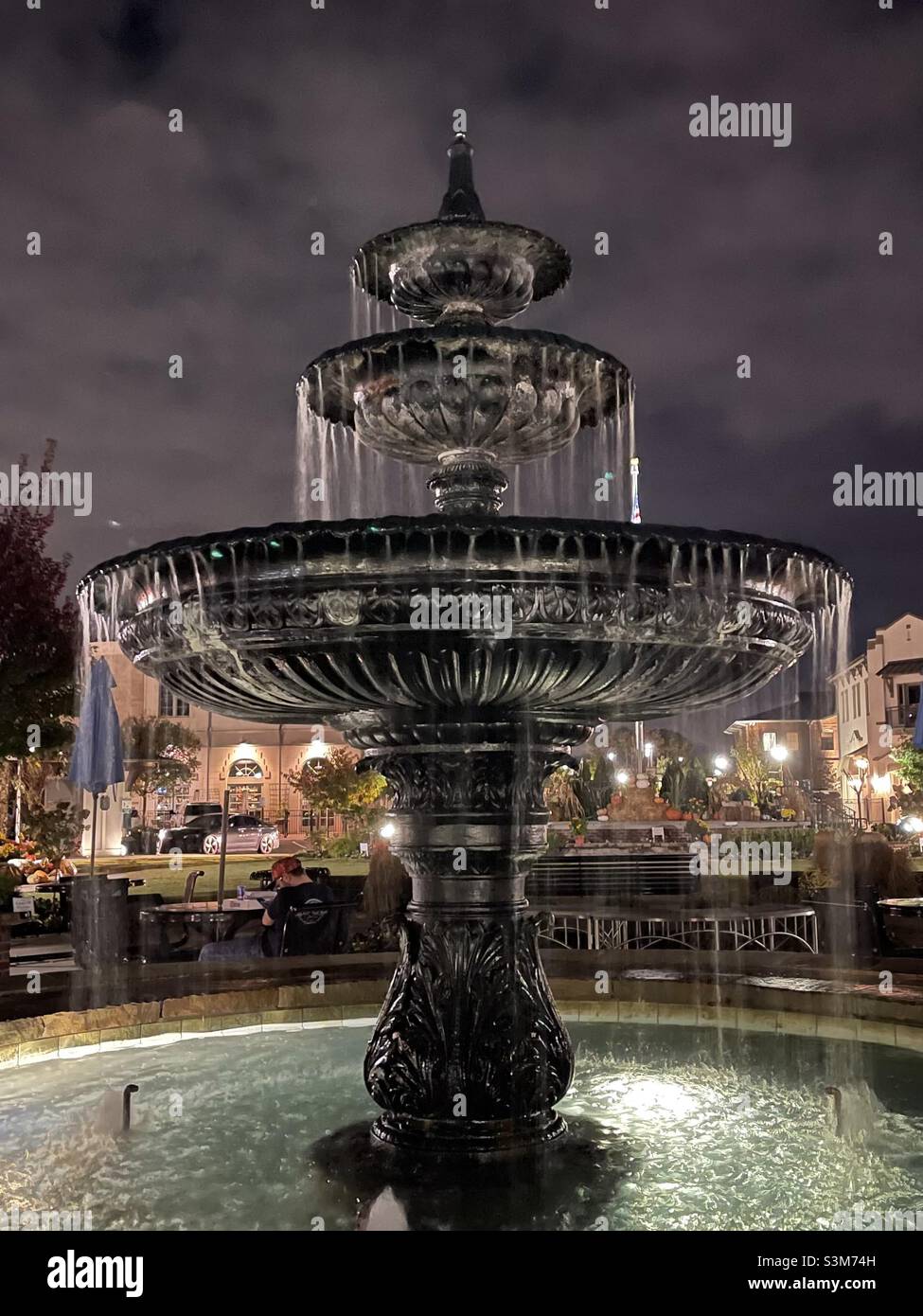 Water fountain at night in town square Stock Photo Alamy