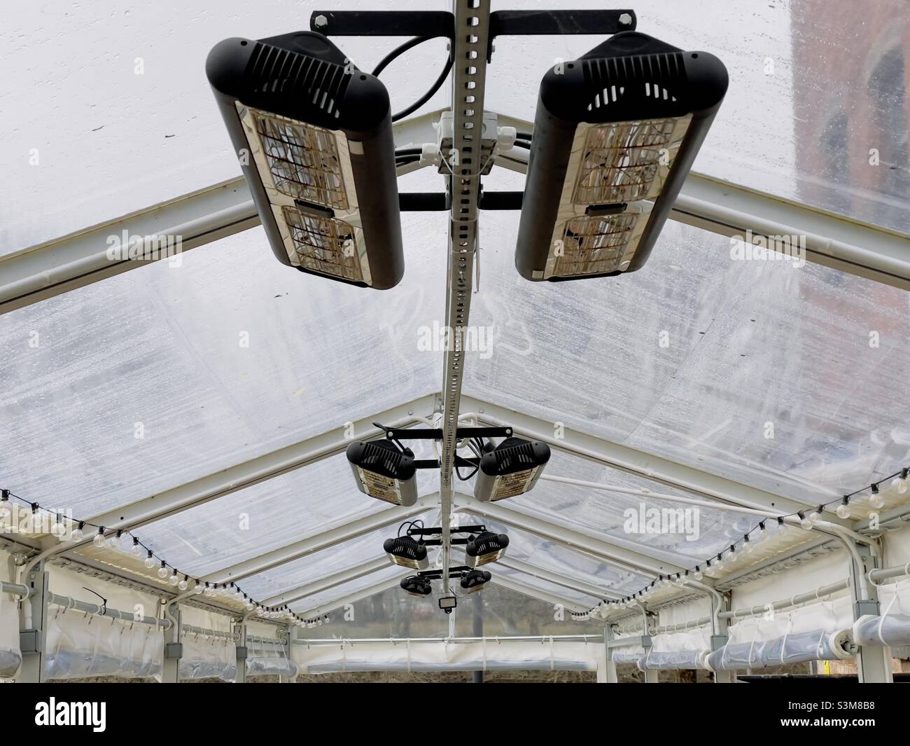 Patio heaters inside a temporary shelter outside a Riverside restaurant in Worcester Stock Photo