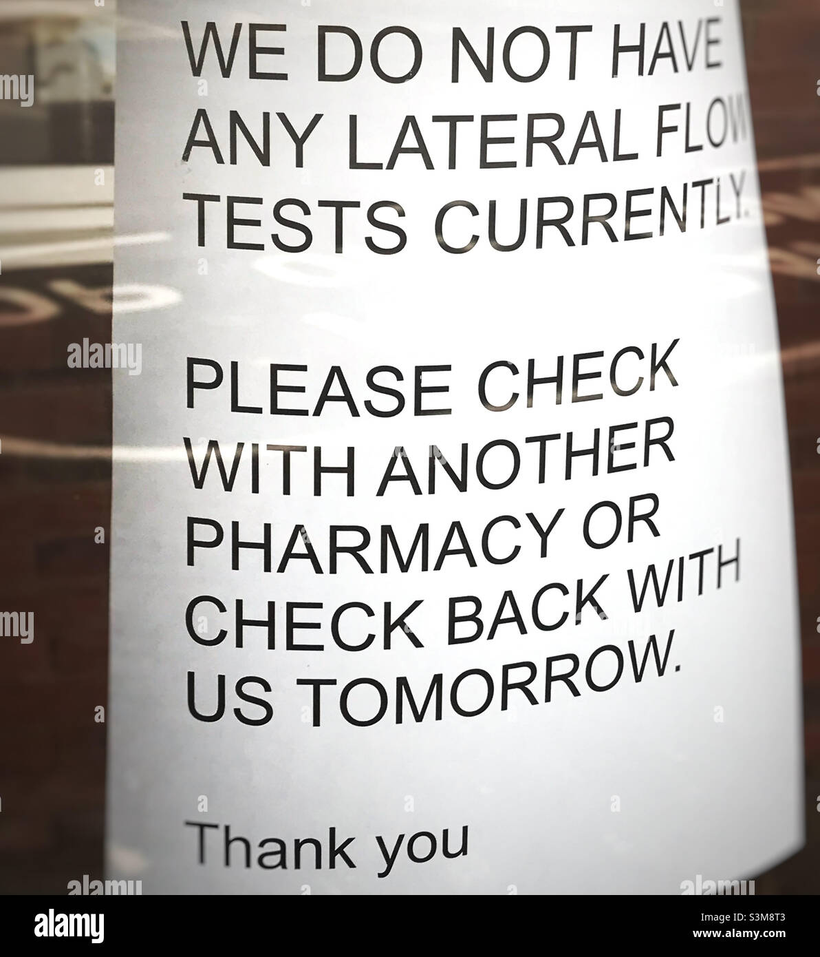 No lateral flow tests available sign in the pharmacy window - Smartphone Captured Stock Image