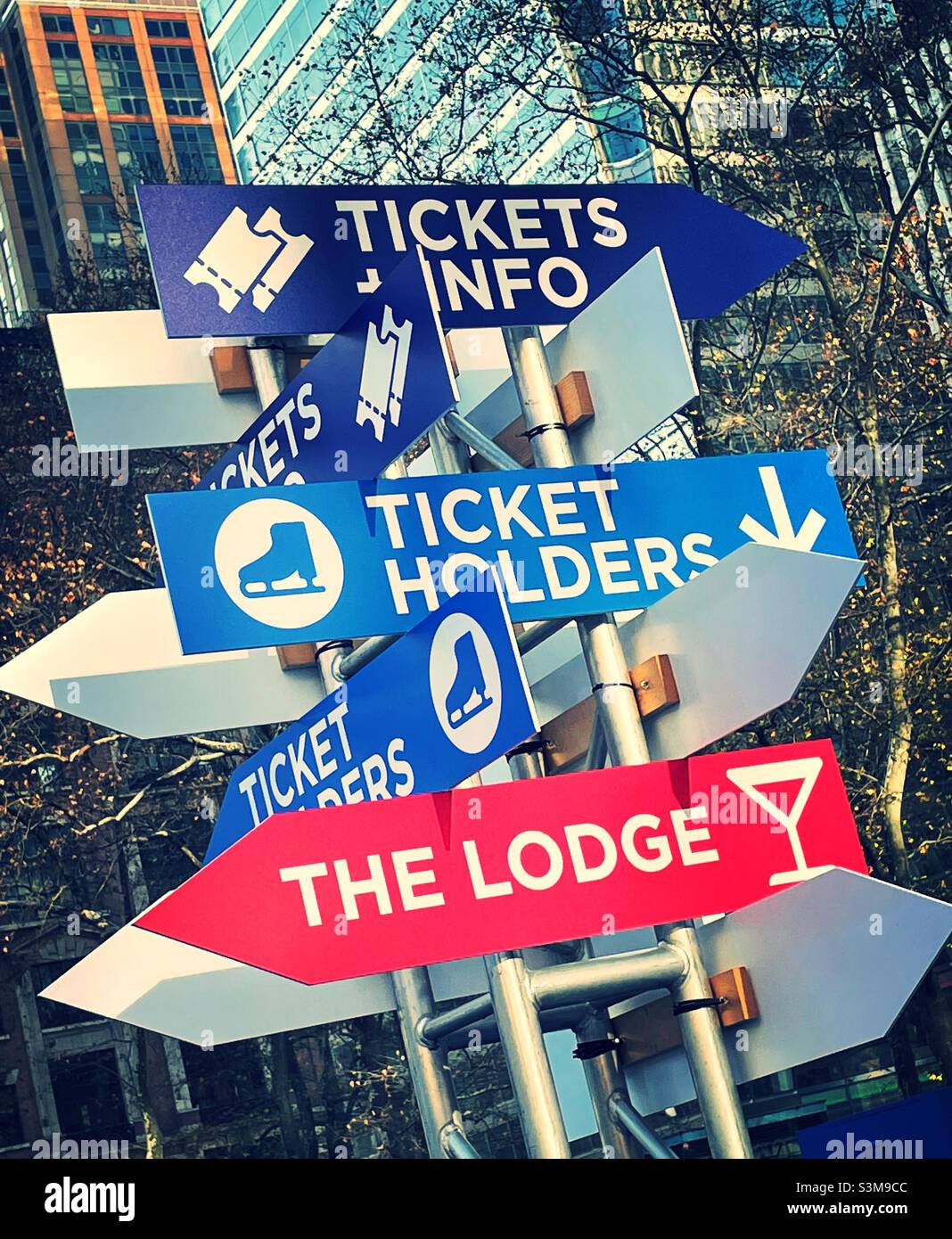 Directional arrow signage at the skating rink at the Bank of America Winter Village in Bryant Park, 2021, New York City, United States - Smartphone Captured Stock Image