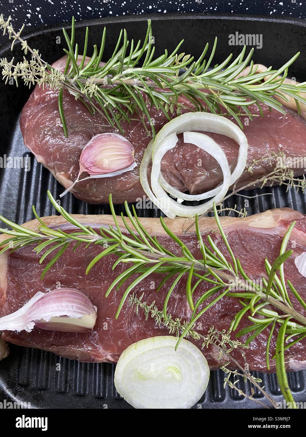Christmas Steak Dinner with rosemary garlic and onions - Smartphone Captured Stock Image