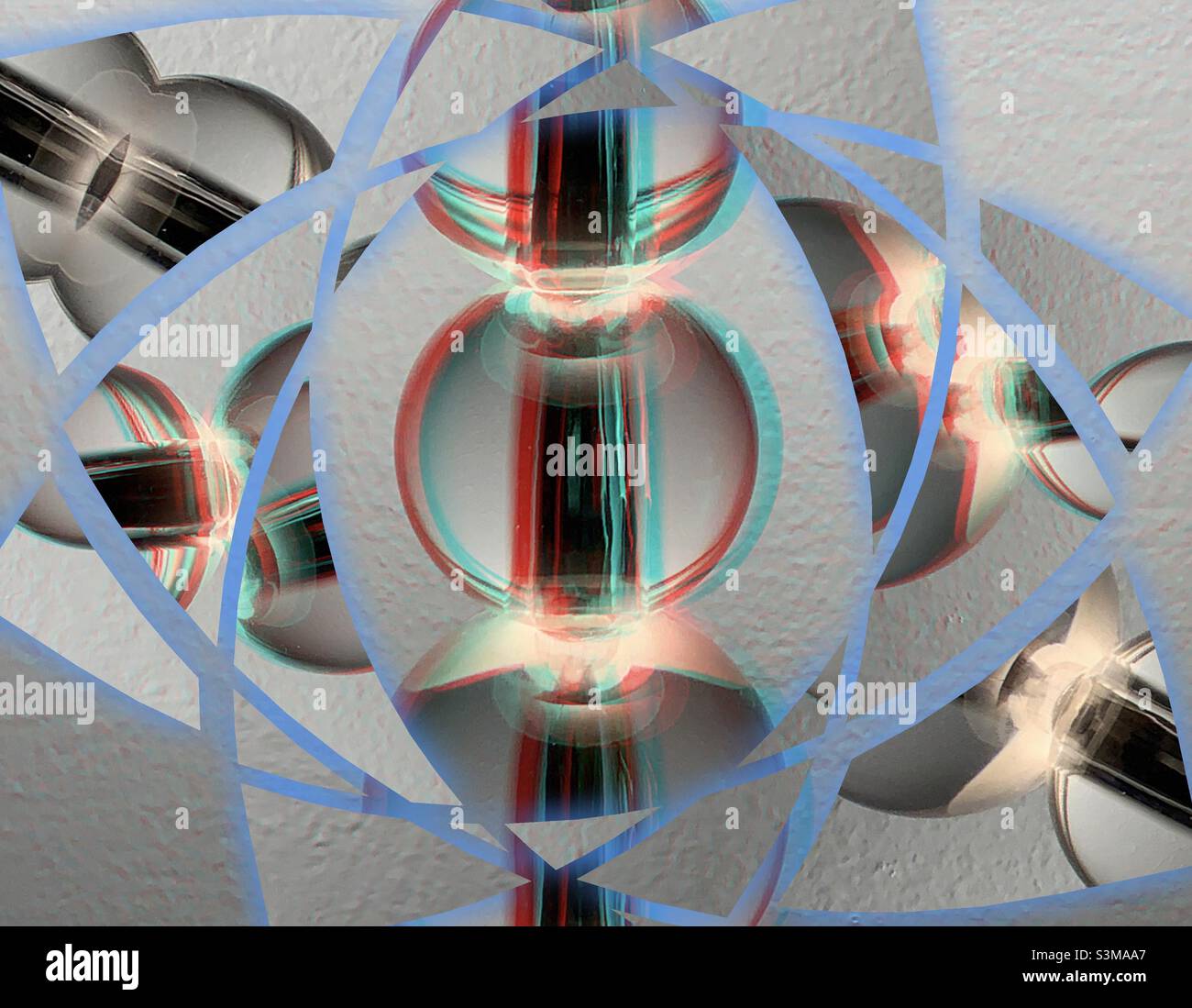 The body of a table lamp has been given a 3D glasses effect and then been framed with a light blue fragmented prism effect. Makes an interesting abstract artwork. - Smartphone Captured Stock Image