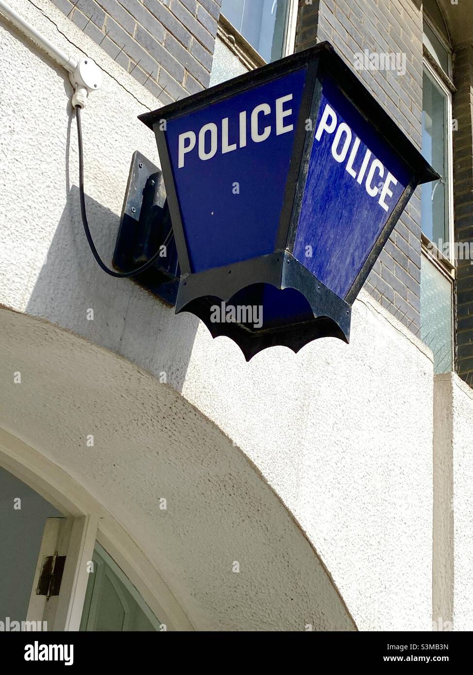 Police light on the wall outside a police station in Gibraltar - Smartphone Captured Stock Image