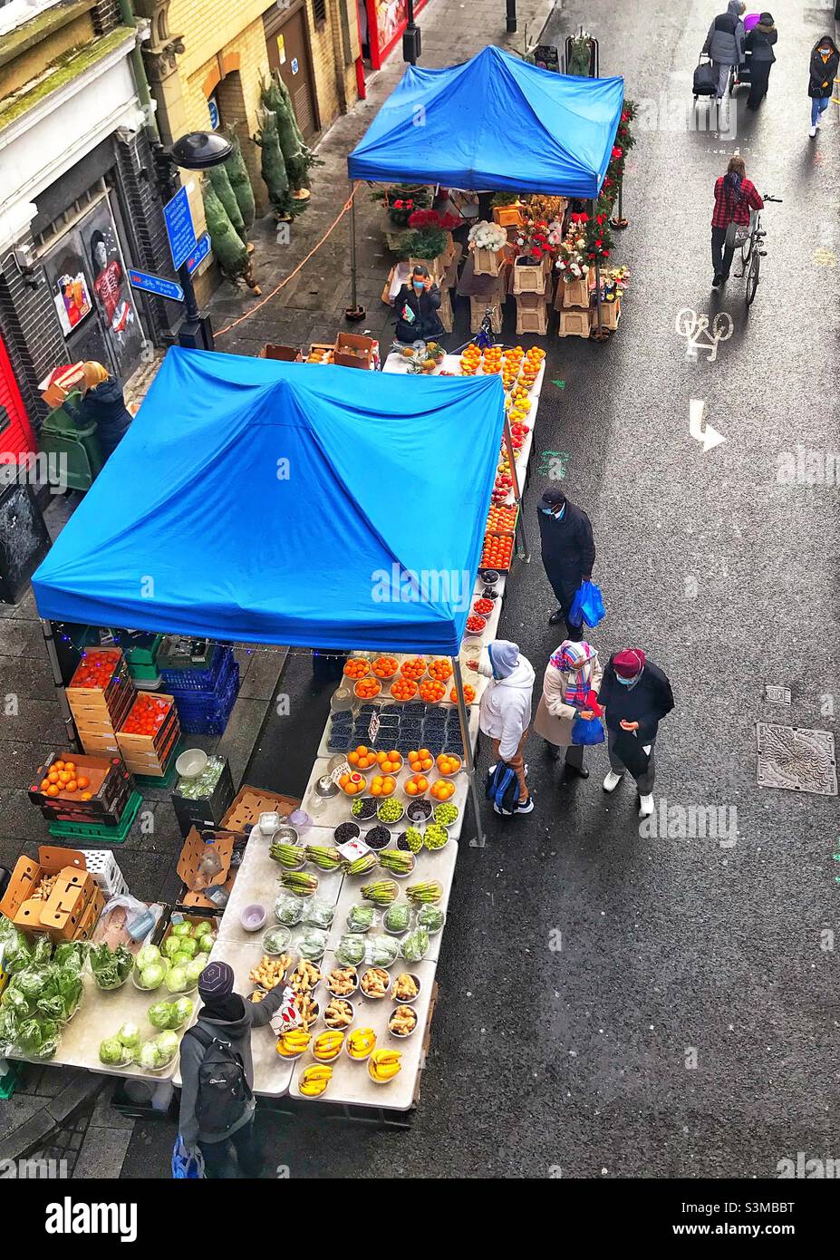 Top view of a pop up stall with blue tent in open street market Stock
