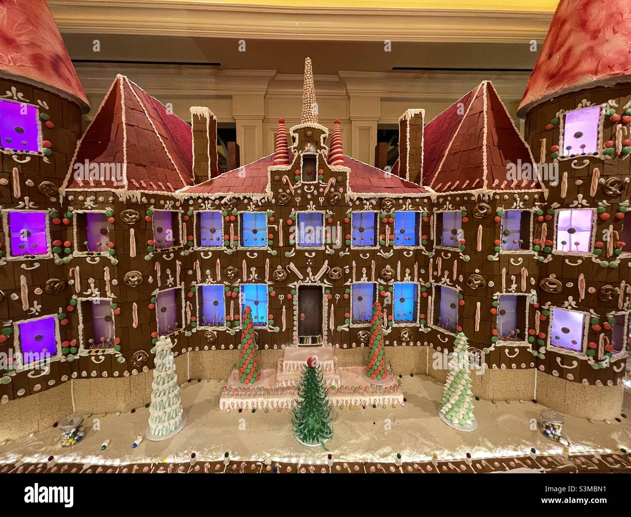 A beautifully designed and decorated gingerbread house, complete with color changing interior lighting, is seen on display inside the Grand America hotel in Salt Lake City, Utah, USA. - Smartphone Captured Stock Image