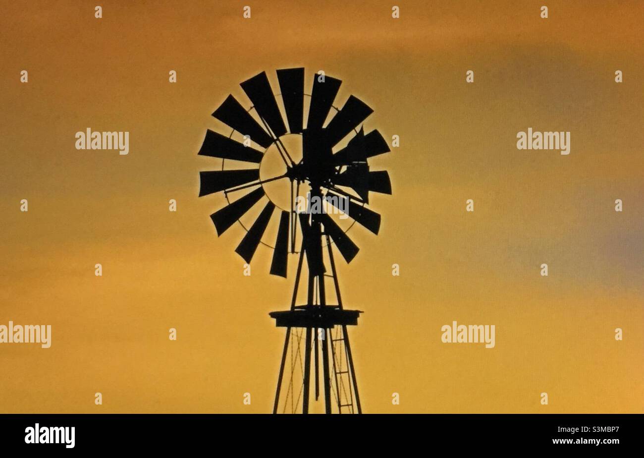 Historic windmill, sunset, prairie, solitude - Smartphone Captured Stock Image