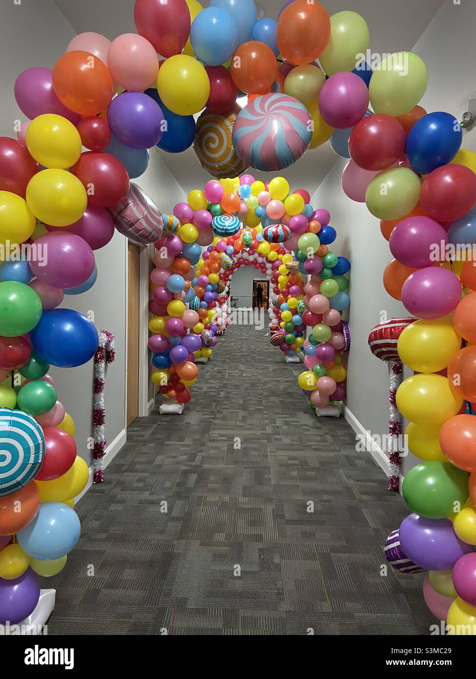 Candyland balloon arch tunnel with bright colors Stock Photo Alamy